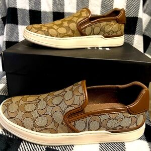 Coach Wells Slip On Sneaker in the color khaki and saddle. Never worn.